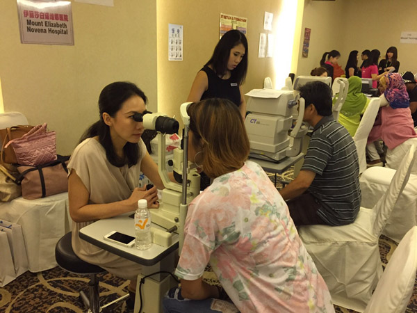 Dr Natasha Lim Event of NTUC eye screening in 2015 