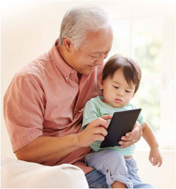 Image showing grandpa and his grandson playing a tablet